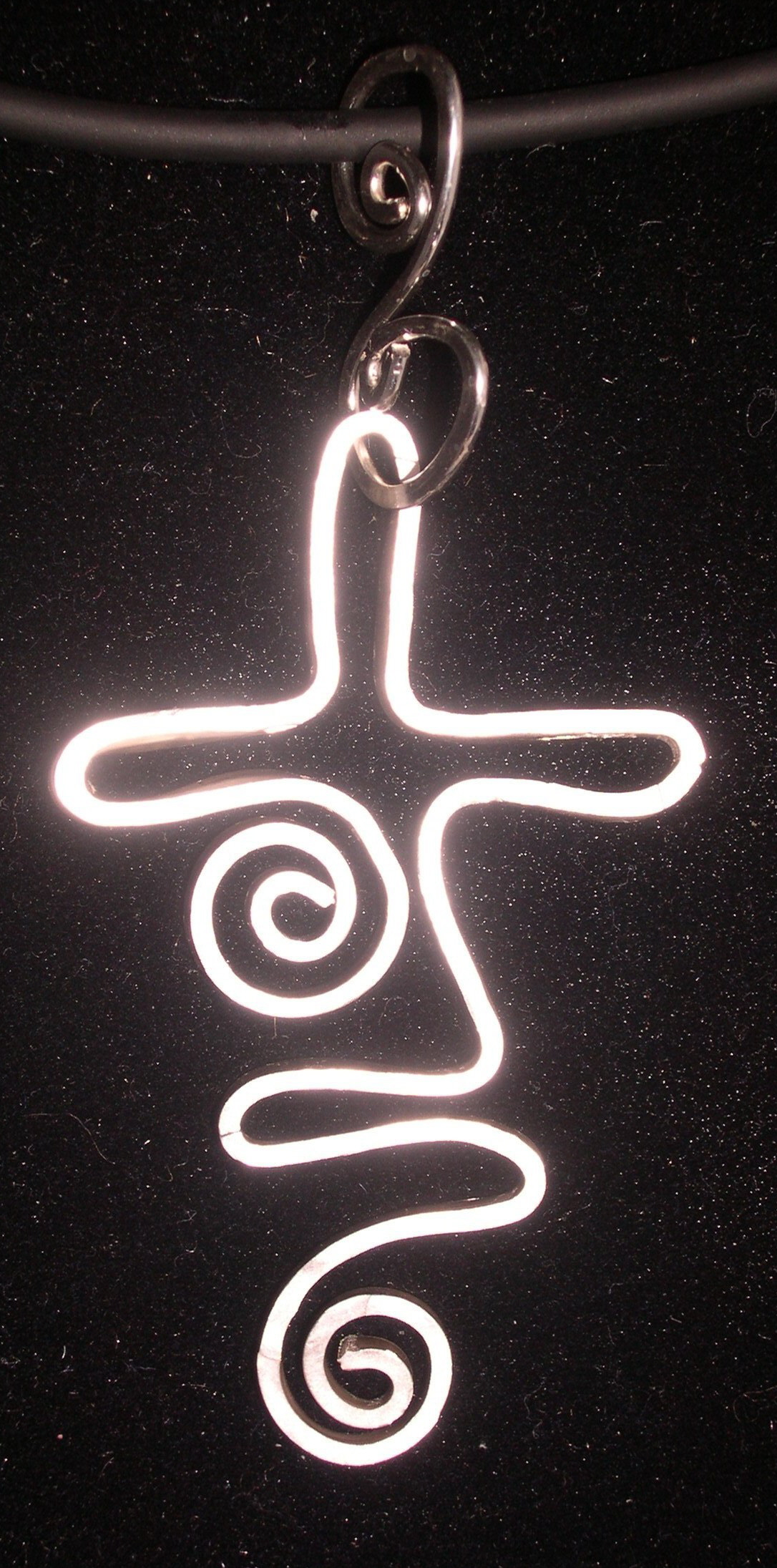 DANCING SWIRL CROSS PENDANT