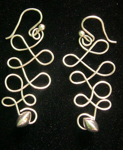 CROSS OVER WAVE EARRINGS