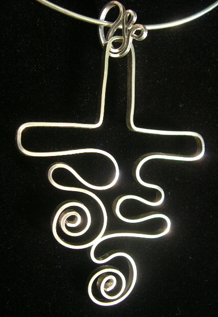 DANCING SWIRL CROSS PENDANT